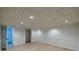 Finished basement with recessed lighting, neutral walls, and new flooring at 731 Sacketts Ct, Lawrenceville, GA 30043
