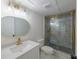Modern bathroom featuring a glass shower with gold trim, new vanity, and modern sink at 731 Sacketts Ct, Lawrenceville, GA 30043