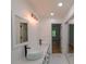 Bright bathroom with a double sink vanity, modern lighting, and sleek fixtures at 731 Sacketts Ct, Lawrenceville, GA 30043