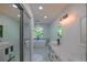 Bright and modern bathroom with a soaking tub, dual sinks, and sleek white finishes at 731 Sacketts Ct, Lawrenceville, GA 30043