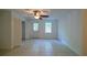 Bright bedroom with tile floors, ceiling fan, and plenty of natural light from two windows at 731 Sacketts Ct, Lawrenceville, GA 30043