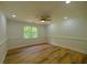 Spacious bedroom featuring wood floors, ceiling fan, recessed lights, and natural light at 731 Sacketts Ct, Lawrenceville, GA 30043