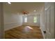 Spacious bedroom featuring hardwood floors, recessed lighting, and windows providing natural light at 731 Sacketts Ct, Lawrenceville, GA 30043
