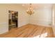 Bright dining room with new floors and a decorative chandelier at 731 Sacketts Ct, Lawrenceville, GA 30043