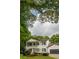 Classic two-story home showcasing large trees, a well-kept lawn, and an attached two-car garage at 731 Sacketts Ct, Lawrenceville, GA 30043