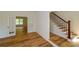 Foyer featuring French doors, staircase, and hardwood flooring at 731 Sacketts Ct, Lawrenceville, GA 30043