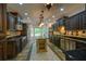 Gourmet kitchen with custom cabinetry, stainless appliances, an island, and tiled floors at 731 Sacketts Ct, Lawrenceville, GA 30043