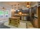 Gourmet kitchen with custom cabinetry, stainless appliances, an island, and unique lighting at 731 Sacketts Ct, Lawrenceville, GA 30043