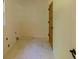 Clean and functional laundry room with marble floors, window, and a door with glass panels at 731 Sacketts Ct, Lawrenceville, GA 30043