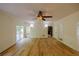 Open living room with modern floors, windows, sliding doors, and recessed lighting at 731 Sacketts Ct, Lawrenceville, GA 30043