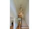 Elegant foyer featuring a staircase with wood treads and a decorative chandelier at 731 Sacketts Ct, Lawrenceville, GA 30043