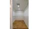 Walk-in closet featuring shelving units and wooden floors at 731 Sacketts Ct, Lawrenceville, GA 30043
