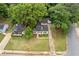 Overhead view of a charming home with green grass and trees at 992 Estes Sw Dr, Atlanta, GA 30310