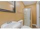 Small bathroom featuring shower with glass door, and white sink at 992 Estes Sw Dr, Atlanta, GA 30310