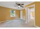 Bedroom with neutral carpet and view of a small window and closet at 992 Estes Sw Dr, Atlanta, GA 30310
