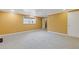 Spacious bedroom features neutral carpeting, fresh paint, and natural light at 992 Estes Sw Dr, Atlanta, GA 30310