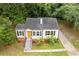 Well-maintained home with black shutters and an orange front door at 992 Estes Sw Dr, Atlanta, GA 30310
