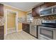 Modern kitchen with stainless steel appliances and mosaic backsplash at 992 Estes Sw Dr, Atlanta, GA 30310