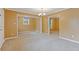 Open-concept layout featuring neutral colored walls and new carpet and ceiling fan at 992 Estes Sw Dr, Atlanta, GA 30310