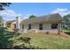 Spacious backyard with patio, grill, and well-maintained lawn, ideal for entertaining and outdoor activities at 1180 Chandler Ridge Dr, Lawrenceville, GA 30045