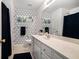 Modern bathroom with stylish geometric wallpaper and long vanity at 1180 Chandler Ridge Dr, Lawrenceville, GA 30045