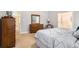 Calming bedroom with neutral tones, soft carpet and traditional wooden furniture at 1180 Chandler Ridge Dr, Lawrenceville, GA 30045