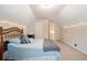 Serene bedroom with sloped ceilings, soft lighting, and neutral decor offers a peaceful retreat at 1180 Chandler Ridge Dr, Lawrenceville, GA 30045