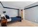 Cozy bedroom with carpet, gray walls, and bed with plush pillows, creating a relaxing atmosphere at 1180 Chandler Ridge Dr, Lawrenceville, GA 30045