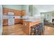 Well-maintained kitchen with ample counter space, light cabinets, and a breakfast bar, providing a functional layout at 1180 Chandler Ridge Dr, Lawrenceville, GA 30045