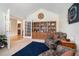 Inviting living room with built-in bookshelves, comfortable chairs, and ample natural light from french doors at 1180 Chandler Ridge Dr, Lawrenceville, GA 30045