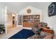 Comfortable living room with a large bookshelf and armchairs at 1180 Chandler Ridge Dr, Lawrenceville, GA 30045