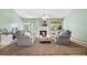 Cozy living room with neutral color palette, plush seating, fireplace, and lots of natural light at 1180 Chandler Ridge Dr, Lawrenceville, GA 30045