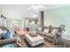 Open-concept living space with plush sofas and bright walls flowing into the dining and kitchen area at 1180 Chandler Ridge Dr, Lawrenceville, GA 30045