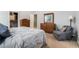 Calm main bedroom with natural light, closet, and en-suite bathroom access, complemented by a cozy sitting area at 1180 Chandler Ridge Dr, Lawrenceville, GA 30045