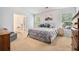 Relaxing bedroom with neutral tones, two windows, and an ensuite bathroom at 1180 Chandler Ridge Se Dr, Lawrenceville, GA 30045