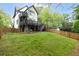 A large backyard features a multi-level deck, ideal for outdoor living and entertaining at 1676 Carroll Nw Dr, Atlanta, GA 30318