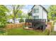 Exterior backyard view of modern home with deck and grass at 1676 Carroll Nw Dr, Atlanta, GA 30318