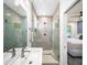 Modern bathroom featuring tiled shower with glass door and vanity sink at 1676 Carroll Nw Dr, Atlanta, GA 30318