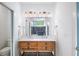 Bathroom with a double sink vanity and a large mirror at 1676 Carroll Nw Dr, Atlanta, GA 30318