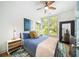 Bright bedroom with large windows, ceiling fan, and modern décor at 1676 Carroll Nw Dr, Atlanta, GA 30318