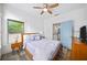 Bedroom with ceiling fan and adjacent ensuite at 1676 Carroll Nw Dr, Atlanta, GA 30318
