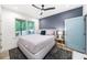 Bedroom with a view of the backyard and equipped with a ceiling fan at 1676 Carroll Nw Dr, Atlanta, GA 30318