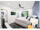 Modern primary bedroom with a window view at 1676 Carroll Nw Dr, Atlanta, GA 30318