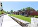 Outdoor common area with bench seating, green space and brick buildings in the community at 1676 Carroll Nw Dr, Atlanta, GA 30318