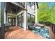 Cozy outdoor deck featuring patio furniture, grill, and views at 1676 Carroll Nw Dr, Atlanta, GA 30318