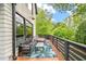 Comfortable deck includes patio furniture and wooded views at 1676 Carroll Nw Dr, Atlanta, GA 30318