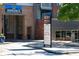 Close exterior view of the commercial building with signage for businesses and leasing office at 1676 Carroll Nw Dr, Atlanta, GA 30318