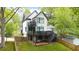 Backyard view of modern house, featuring deck, patio, and landscaped yard at 1676 Carroll Nw Dr, Atlanta, GA 30318