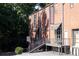 A brick building with signs for 'Coffee Personal' and 'Hickory Chair' and an entrance stairway at 1676 Carroll Nw Dr, Atlanta, GA 30318