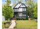 Charming two-story home with modern black and white exterior and well-manicured front yard at 1676 Carroll Nw Dr, Atlanta, GA 30318